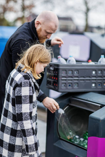 istock Family recycling plastic bottles 1221862818