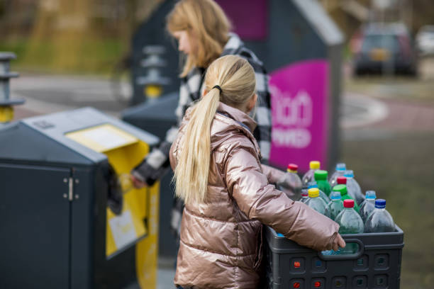 istock Two Young girls at a recycling centre 1221864055