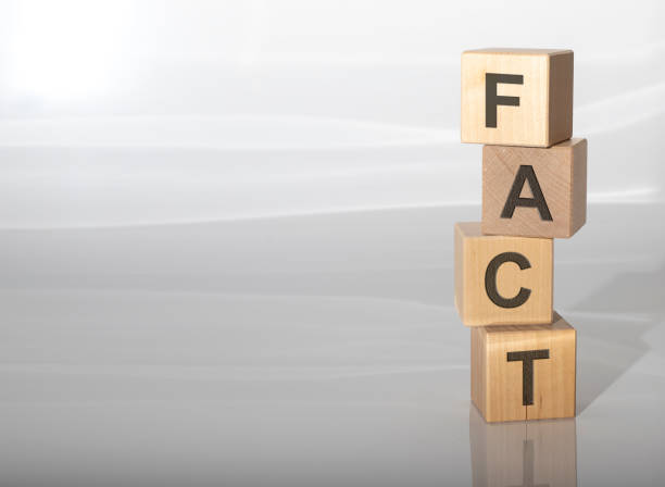 istock concept word FACT on cubes on a grey glossy background with reflection 1221867895