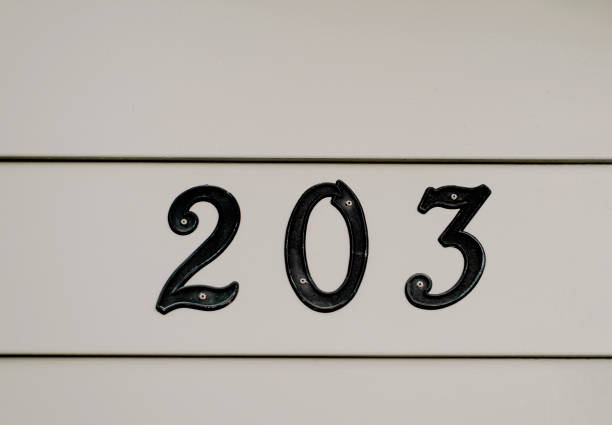 203 House Address Numbers in Black Against Gray - foto stock