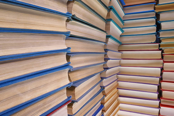istock Old textured books pile close up 1221869427