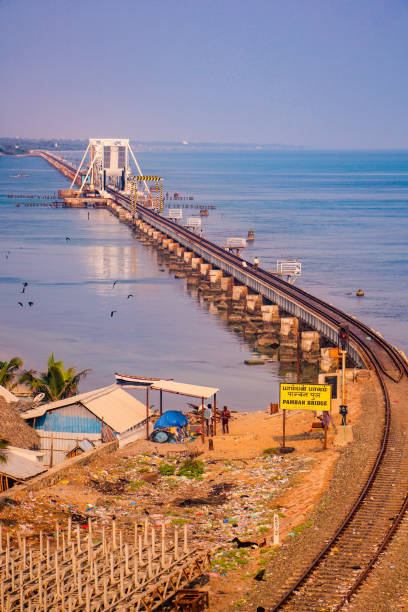 Pamban Bridge is a railway bridge which connects the town of Mandapam in mainland India with Pamban Island in Rameswaram. Pamban Bridge is a railway bridge which connects the town of Mandapam in mainland India with Pamban Island in Rameswaram.. musical instrument bridge stock pictures, royalty-free photos & images