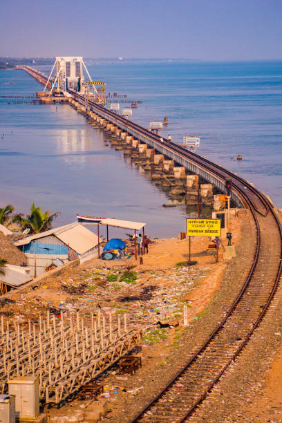 Pamban Bridge is a railway bridge which connects the town of Mandapam in mainland India with Pamban Island in Rameswaram. Pamban Bridge is a railway bridge which connects the town of Mandapam in mainland India with Pamban Island in Rameswaram.. musical instrument bridge stock pictures, royalty-free photos & images