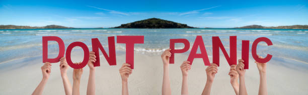 istock People Hands Holding Word Dont Panic, Ocean Background 1221869892