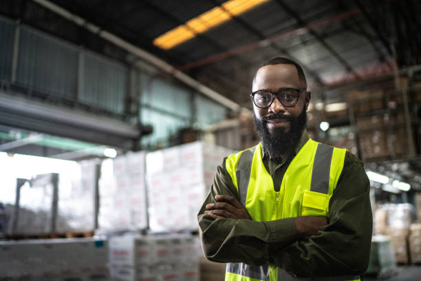Logistics employee warehouse portrait Logistics employee warehouse portrait manufacturing occupation stock pictures, royalty-free photos & images