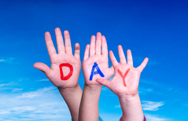 istock Children Hands Building Word Day, Blue Sky 1221869960