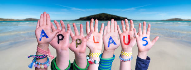 Children Hands Building Word Applause Means Applause, Ocean Background Children Hands Building Colorful German Word Applaus Means Applause. Ocean And Beach As Background applaus stock pictures, royalty-free photos & images