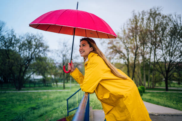 istock Woman is enjoying a rainy day 1221870406