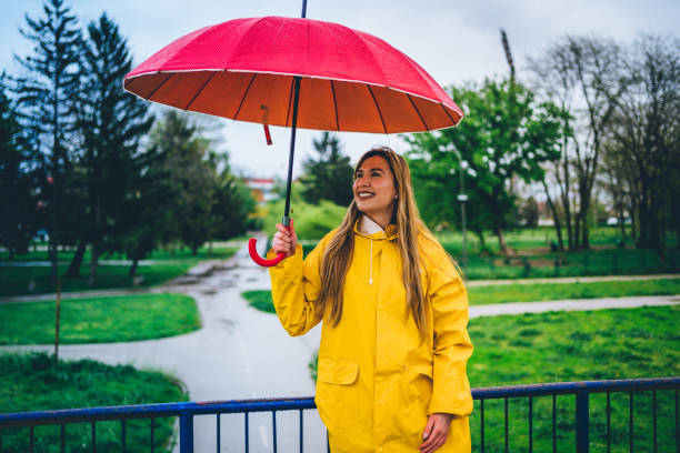 istock Woman is enjoying a rainy day 1221870484