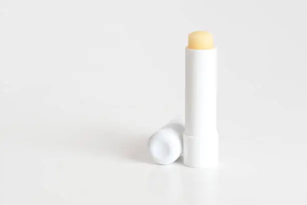 Lip balm packaging mock-up on light white background.