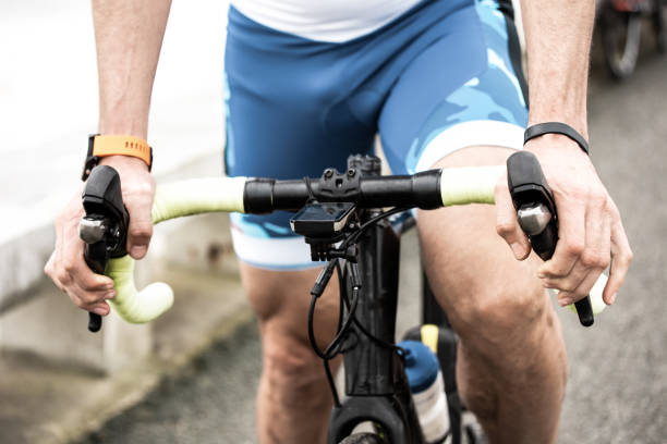 istock Partial view of man riding bicycle near sea 1221871028
