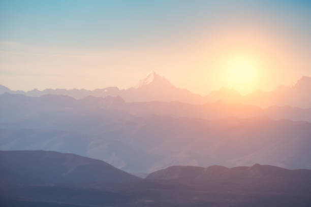 Blurred scene of Peak on mountain range with sunrise at morning