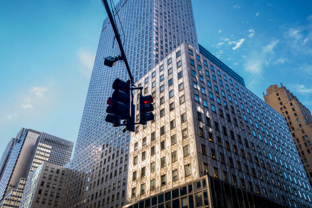 istock Looking up at Manhattan intersection wit h straffic lights at 42nd street and 3rd ave business buildings and skyscrapers 1221871286