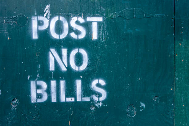 istock post no bills spray painted text letters on closed off unrban contrustion area 1221871302