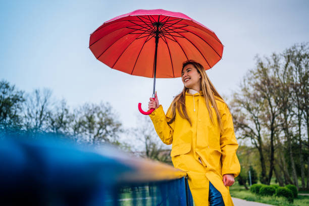 istock Woman is enjoying a rainy day 1221871585
