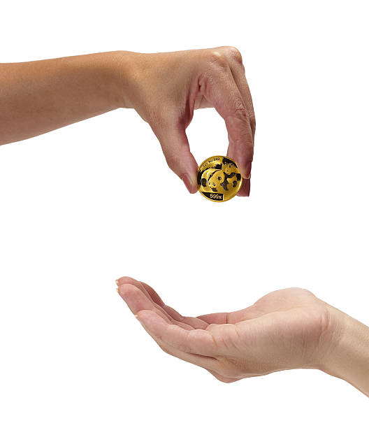 istock Woman holding coin panda 122187244