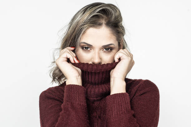 istock Young woman in turtleneck looking at camera 1221872575