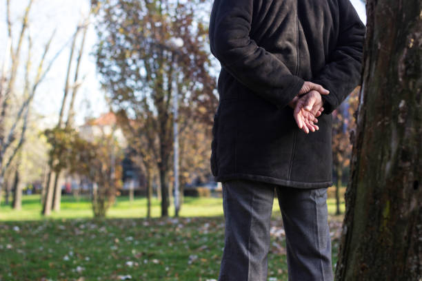 istock Senior man walking and relaxing in park 1221874058