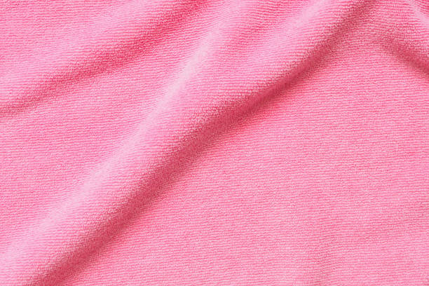 istock Pink towel fabric texture surface close up background 1221874634