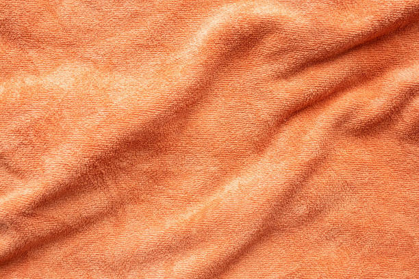 Orange towel fabric texture surface close up background