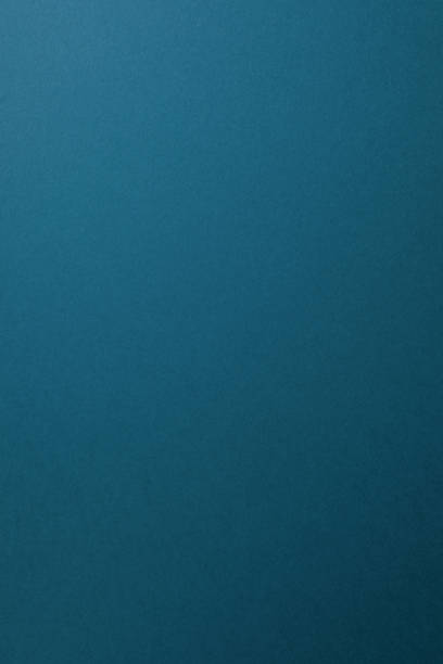 istock aquamarine paper background, copy space, vertical. 1221876268