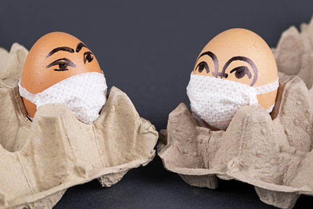 istock Eggs  wearing medical masks 1221876626
