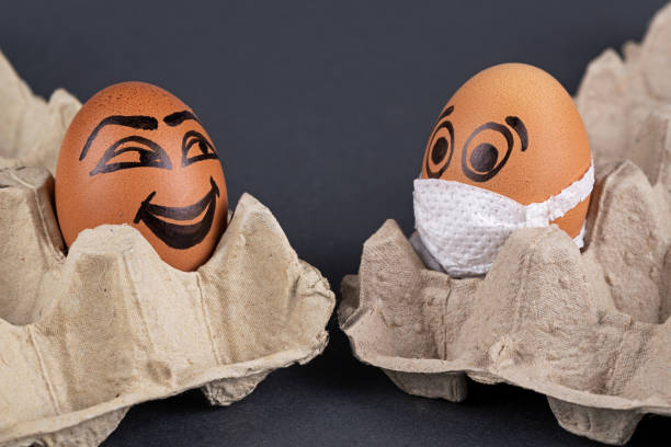 istock Eggs  wearing medical masks 1221876831