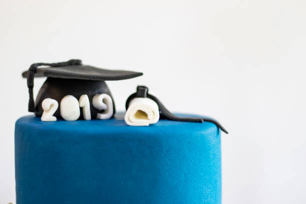 istock Graduation party. Cake table with sweets and decoration 1221880135