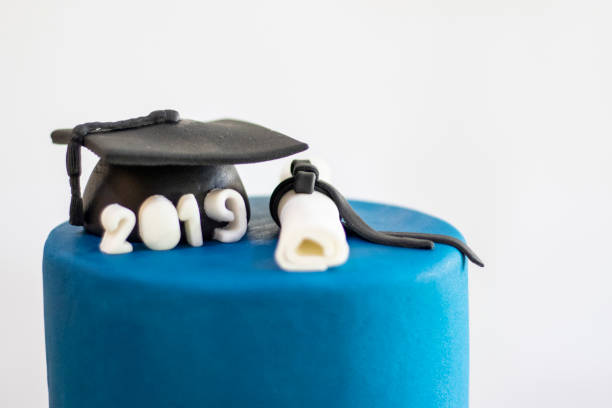 istock Graduation party. Cake table with sweets and decoration 1221880200