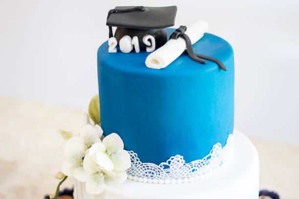 istock Graduation party. Cake table with sweets and decoration 1221880241