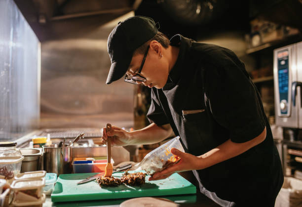 istock Busy shift in fast food restaurant - essential workers during pandemic quarantine 1221881245