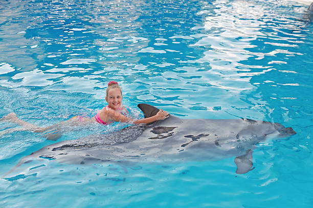 istock Girl and the Dolphin 122188166