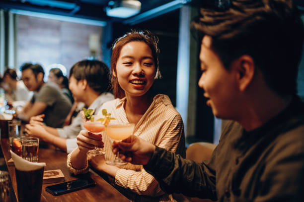 istock Asian couple going out and drinking cocktails 1221881704