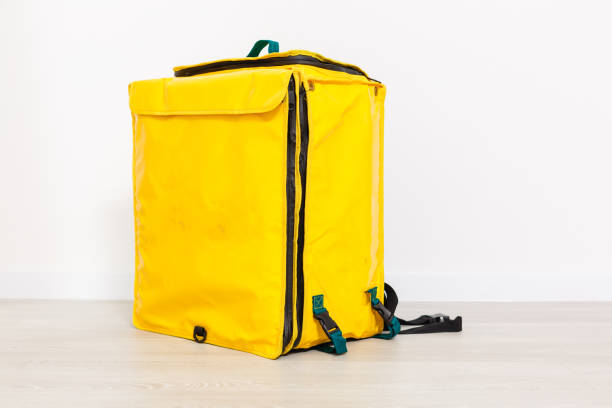 istock Cropped view of delivery thermo bag on grey, 1221883383