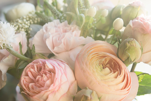roses, carnations and lots and lots of little flowers, fresh fragrance, pastel tone. it's just beautiful