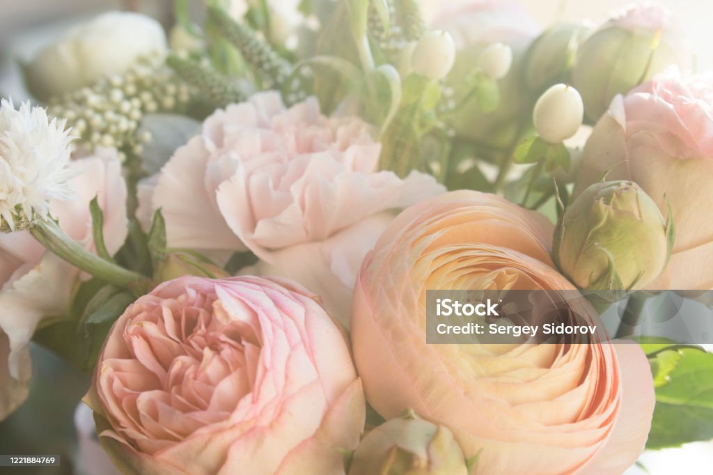 A magical bouquet of flowers in pastel colors roses, carnations and lots and lots of little flowers, fresh fragrance, pastel tone. it's just beautiful Flower Stock Photo
