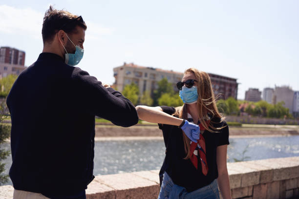 istock Responsible boyfriend greeting his girlfriend with elbow bump 1221885030