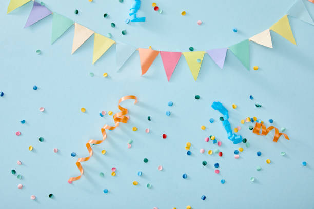 istock top view of colorful confetti on blue background 1221886395