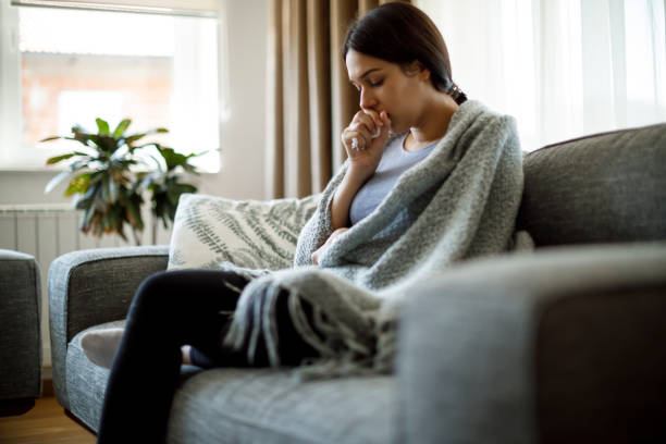 istock Ill woman coughing 1221887210