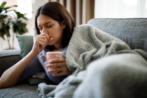 Ill woman coughing