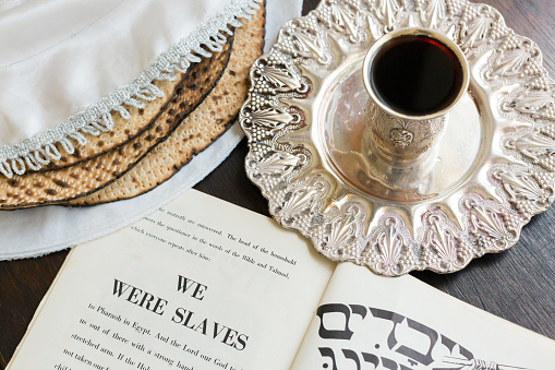 Passover wine, matza and haggadah.