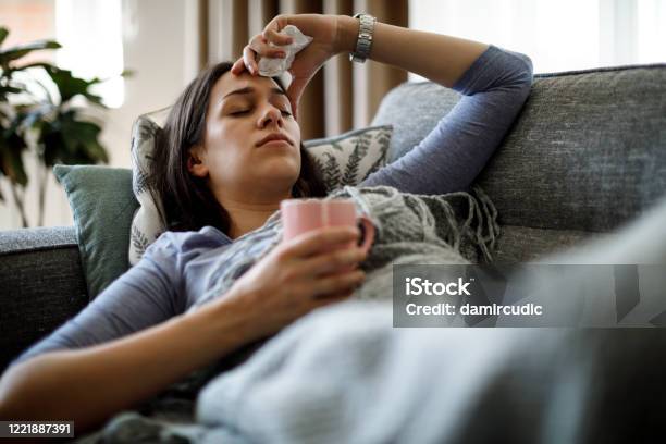 Sick Woman Lying In Bed Stock Photo - Download Image Now - Cold And Flu, Symptom, Coronavirus