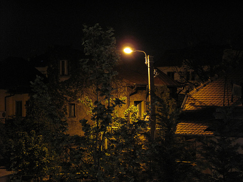 Street lamp illuminating buildings in Eastern Europe at night