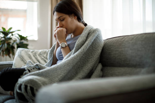 istock Ill woman coughing 1221888334