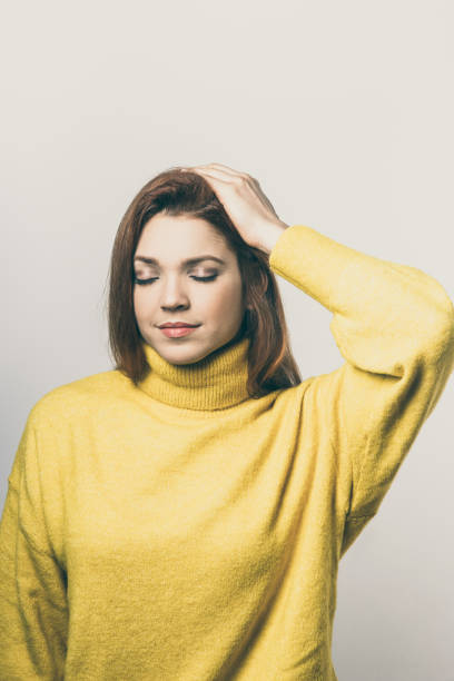 istock Tranquil young woman with hand on head 1221894918
