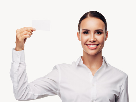 Excited woman showing blank business card