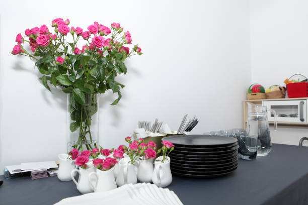 istock Shrub roses in a vase on a served table as a decoration 1221898517