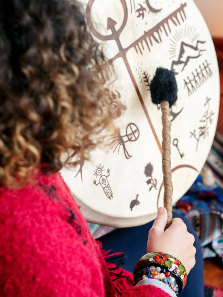 istock shaman woman playing Shamanic drum 1221898810