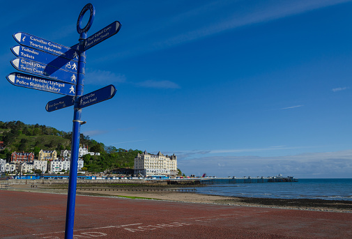Llandudno, UK : May 6, 2019: A general scenic view of the promenade on North Shore, Llandudno. Very few people are out to enjoy the morning sunshine.