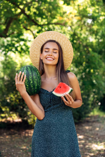istock Enjoying sunny day wile eating watermelon 1221899625